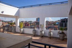 Rooftop terrace relaxation area at The Moon Serenity Furnished Apartments Ruaka featuring outdoor seating, decorative plants, and relaxing views for guests.