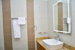 Modern ensuite bathroom with shower in The Moon Serenity Furnished Apartment at Lymack Suites, Fourways Junction near Kiambu Road
