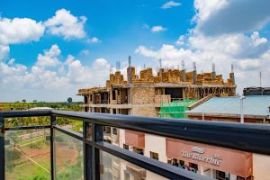 Balcony view from studio apartment at The Moon Serenity Furnished Apartments in Ruaka overlooking surrounding urban landscape