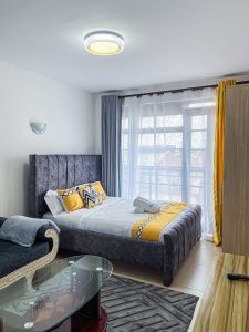 Bed area in furnished studio apartment in Ruaka at The Moon Serenity