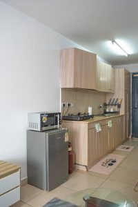 Modern kitchen in a furnished studio apartment at The Moon Serenity Ruaka Branch