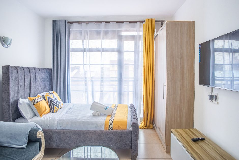 Modern studio apartment living area with smart TV at The Moon Serenity Ruaka Branch in Nairobi
