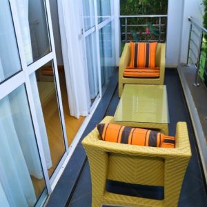 Luxury balcony sitting area at The Moon Serenity Furnished Apartments Fourways Branch featuring modern outdoor furniture and relaxing views in Ruaka near Fourways Junction.