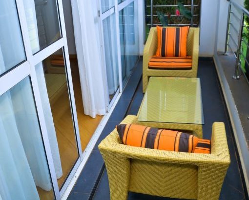 Luxury balcony sitting area at The Moon Serenity Furnished Apartments Fourways Branch featuring modern outdoor furniture and relaxing views near Fourways Junction.