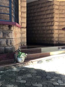 Outdoor seating area at The Moon Serenity Furnished Apartments Thindigua Branch at Kalwani Park with surrounding landscaped gardens, secure car parking and relaxing guest space